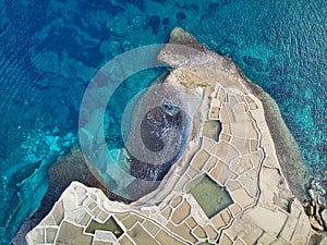 Aerial top view of Salt evaporation ponds on the coast of the island of Gozo also called Salinas