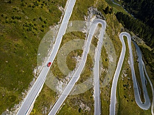Aerial top view on scenic curvy mountain pass road to the Timmelsjoch at the border of Italy and Austria in the Alps
