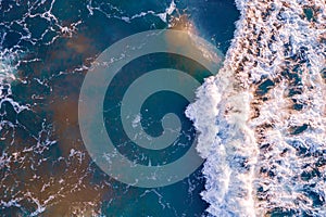 Aerial top view sea amazing nature background with big wave. Turquoise and clear water of ocean at sunny day