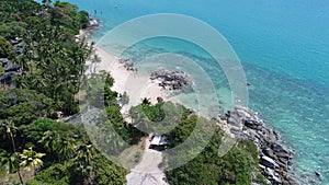 Aerial top view of sea coastline and island with palm trees