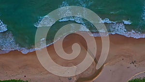 Aerial top view sea waves seamless loop on the white Phuket sand beach