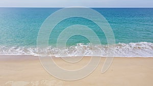 aerial top view sea waves seamless loop on the white sand beach.