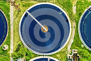 Aerial top view of sewage treatment plant. Water treatment in round pools