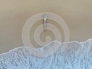 Aerial  top view with Sexy bikini body woman sun tanning relaxing sunbathing on the beach background-Summer travel concept