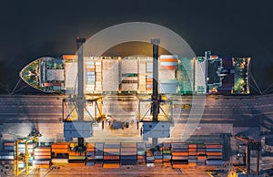 Aerial top view of ship containers at shipping port for international import or export logistics or transportation business