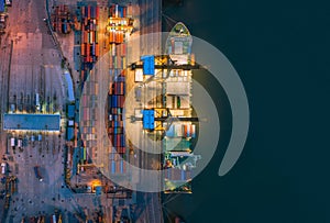 Aerial top view of ship containers at shipping port for international import or export logistics or transportation business