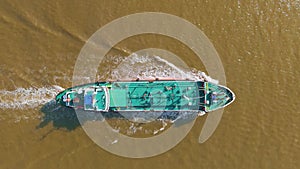 Aerial top view ship liquid cargo floating river.