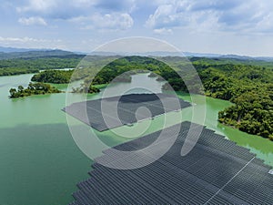 Aerial top view of solar panels or solar cells on buoy floating in lake