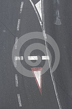 Aerial top view of some traffic signs on asphalt