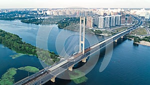 Aerial top view of South Bridge in Kiev city from above, Kyiv skyline and Dnieper river cityscape, Ukraine