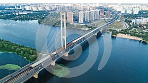 Aerial top view of South Bridge in Kiev city from above, Kyiv skyline and Dnieper river cityscape, Ukraine