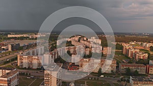 Aerial top view of storm coming arriving at a district of Soviet design - Sunset in european capital Riga, Latvia -