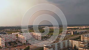 Aerial top view of storm coming arriving at a district of Soviet design - Sunset in european capital Riga, Latvia -