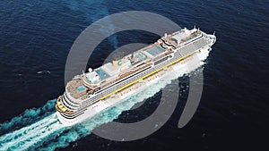 Aerial top view of stunning cruise ship at Black sea. Stock. Large cruise ship with people on the upper deck and a