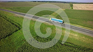Aerial Top View of Truck with Cargo Semi Trailer Moving on Road