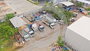 Aerial top view of truck cars parking in local warehouse in transportation and logistic concept