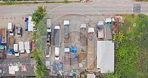 Aerial top view of truck cars parking in local warehouse in transportation and logistic concept