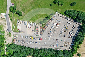 Aerial top view of trucks on parking lot. suburban industrial district. drone photo