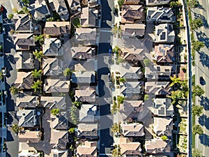 Aerial top view of upper middle class neighborhood with residential house next to each other