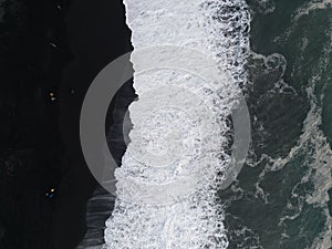 Aerial top view of wave of Black Sand Beach Reynisfjara in Iceland