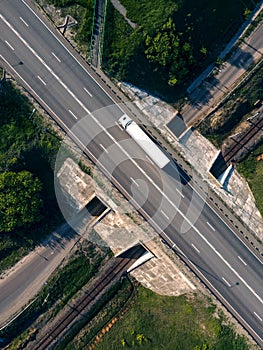 Aerial Top View of White Truck with Cargo Semi Trailer Moving on