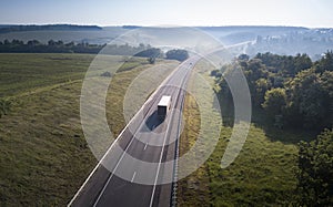 Aerial Top View of White Truck with Cargo Semi Trailer Moving on Road in Direction