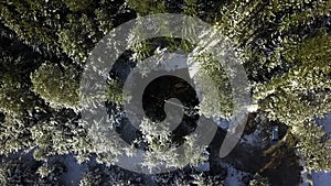 Aerial top view of work on a construction site during winter. Clip. Workers and equipment for works with cold ground.