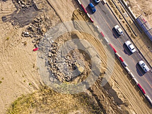 Aerial top view of yellow bulldozer work dig soil f