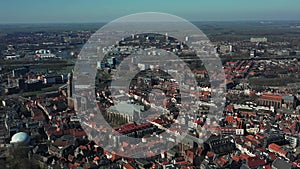 Aerial top view of Zwolle, surrounded by houses, green trees and canal