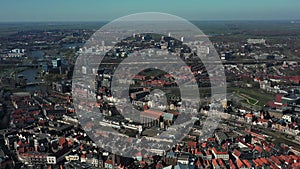 Aerial top view of Zwolle, surrounded by houses, green trees and canal