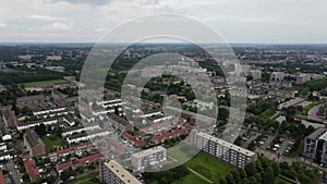 Aerial top view of Zwolle, surrounded by houses, green trees and canal