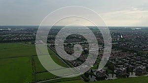 Aerial top view of Zwolle, surrounded by houses, green trees and canal