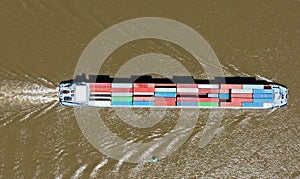 Aerial topshot from a cargo boat cruising on the river Merwede in the Netherlands
