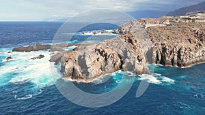 Aerial tracking view of ocean waves and rocks, Tenerife, Canary islands, Spain