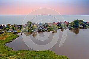 Aerial from the traditional village Uitdam at the IJsselmeer in the Netherlands photo