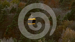 Aerial Tram Rides Over the Forest in Late Autumn in Sigulda.