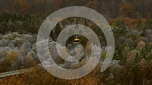 Aerial Tram Rides Over the Forest in Late Autumn in Sigulda.