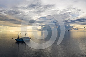 Aerial of Tranquil Sunrise and Ship in Raja Ampat