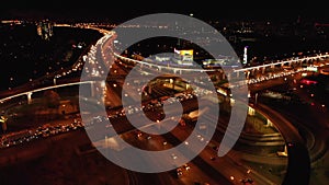 Aerial transport road junction. Modern city traffic road at night. Transport road junction.