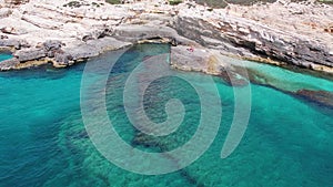 Aerial of turquoise deep water and white rocks of Croatia coast