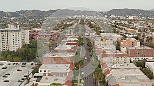 AERIAL: Typical Houses , Apartments , Residential Area in West Hollywood, California with Beautiful Rich colors in Trees