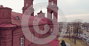 Aerial. Unveiling drone shot of St. Peter and Paul`s church in Panevezys. Spring afternoon in Lithuania