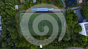 Aerial urban view of the football field with players