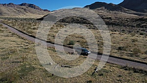 Aerial Utah desert circle vehicle dirt road 4K