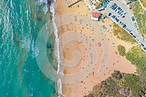 Aerial vew fying drone view of the beach with sunbathers resting people photo