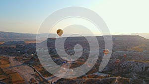 Aerial video. Captured against the canvas of the Cappadocian sky, this video showcases the enchanting spectacle of a hot