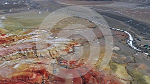 Aerial video from drone over frozen Kyzyl Chin river under ice. The tourist name of this territory is Mars. Altai, Siberia, Russia