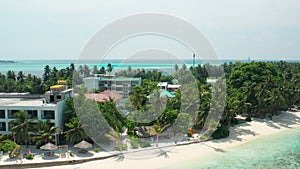 Aerial video from a drone over a typical bungalows and hotel for tourists in the Maldives. View from the drone on the roofs of the