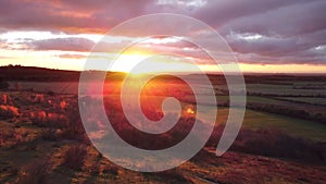 Aerial video establishing shot of countryside in Oxfordshire at sunset