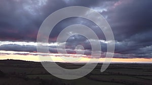 Aerial video establishing shot of countryside in Oxfordshire at sunset